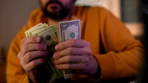 Close-up counting stacks of dollars by hand. Finance and money payment concep Stock Footage 266473438