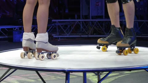 Close-up of a couple of acrobats on roller skates performing in a circus. Stock Footage 311152323