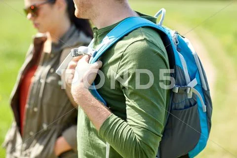 Close up of couple with backpacks hiking outdoors Stock Photos
