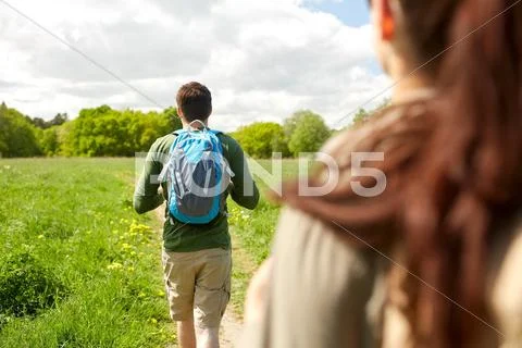 Close up of couple with backpacks hiking outdoors Stock Photos