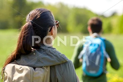 Close up of couple with backpacks hiking outdoors Stock Photos