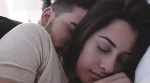 Close up of couple in bed Stock Footage 58414911