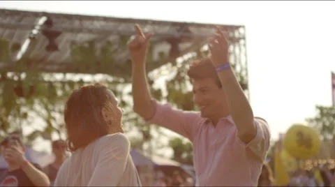 Close up of couple dancing at a concert 
at sunset Stock Footage 63076911
