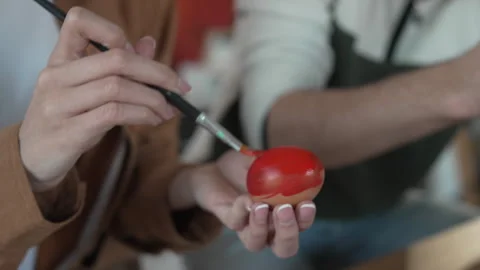 Close up on couple hands hands paint decorative easter egg in living room Stock-Footage 301917053