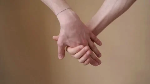Close up of a couple holding hands lovingly Stock Footage 335038872