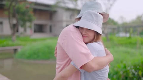 Close-up of a couple hugging each other standing in a garden. Family, people, Video stock 265052525