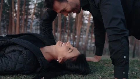 The close-up of the couple in love, the man does push-ups, and when he reaches Stock Footage 154683166