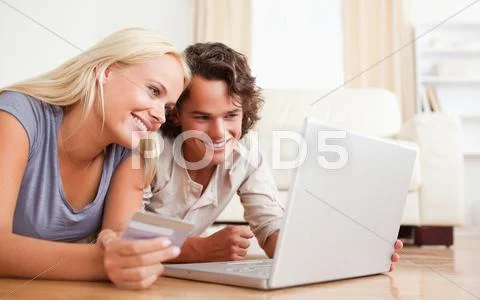 Close up of couple purchasing online Stock Photos