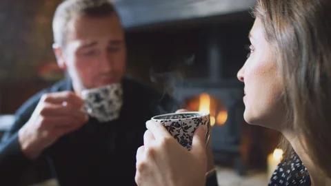 Close Up Of Couple Sitting At Table Drinking Tea In Traditional English Holiday Stock Footage 114301087