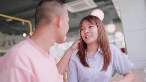 Close-up of a couple spending time together in a coffee shop. Happy couple sitti Stock Footage 265231505