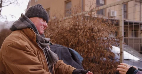 Close Up Of Couple Warming Up By The Fire Stock Footage 128774527