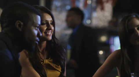 Close up of couples at a table in a club cheer there drinks Stock Footage 34006010