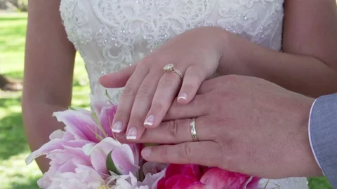 Close up of couples wedding ring hands on their wedding day in Maui Hawaii. Video stock 136266435