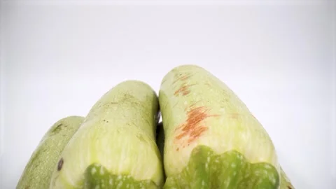 Close up of courgette on white background isolated Stock Footage 332124437
