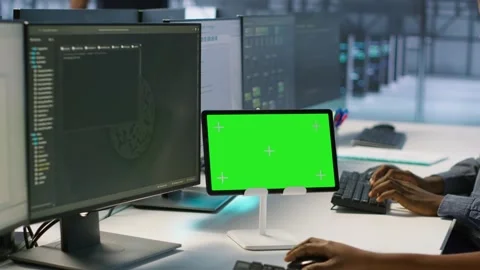 Close up of coworkers coding on chroma key device in data center Stock Footage 319521807