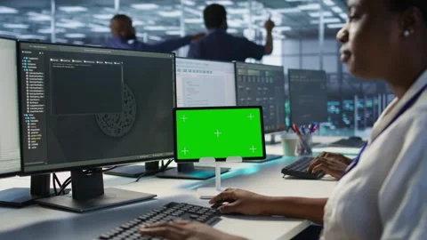 Close up of coworkers coding on chroma key device in data center Stock Footage 319564167