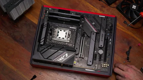 Close-up of CPU cooler installation on a motherboard. Perfect for tech Stock Footage 301636495