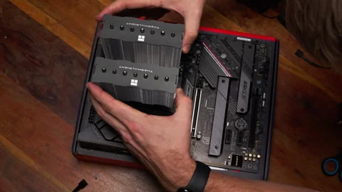 Close-up of CPU cooler installation on motherboard. Ideal for tech tutorials Stock Footage 301785053