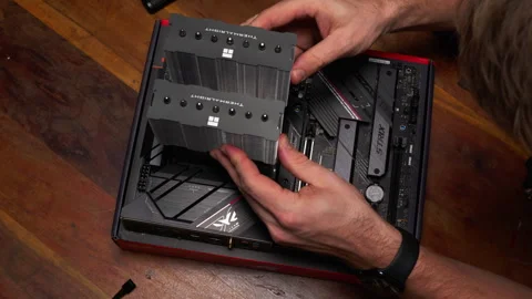 Close-up of CPU cooler installation on motherboard. Ideal for tech tutorials Stock Footage 301785097