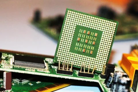 Close up of CPU Processor over Computer Motherboard. Tecnology background. Stock Photos