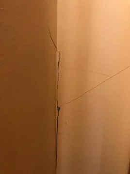 A close up of a crack corner wall. Stock Photos