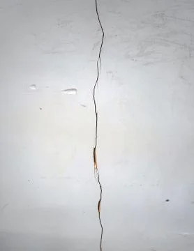 Close up of a crack in a white wall Stock Photos