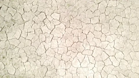 Close up of cracked dry soil, top view, low aerial, drought concept, day Stock Footage 237581893