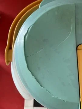 Close-up of cracked old plastic kitchen container Stock Photos