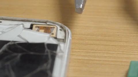 Close Up of Cracked Smartphone Screen Showing Damaged Display After Accidental Stock Footage 340799085