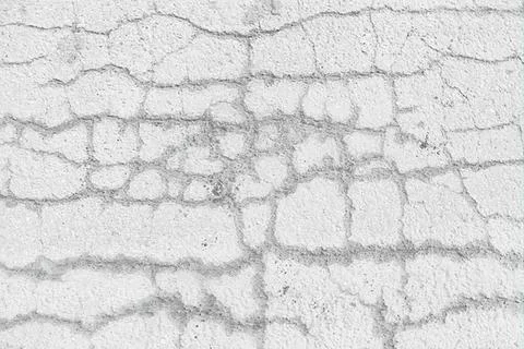 Close-up of cracked white wall with texture and lines Stock Photos