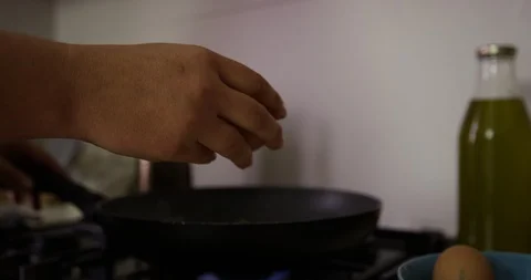 Close Up Of Cracking Eggs Into Frying Pan Stock Footage 125017892