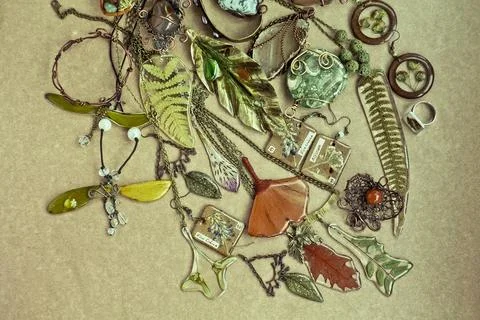 Close up craft bijouterie with floral elements set concept photo Stock Photos
