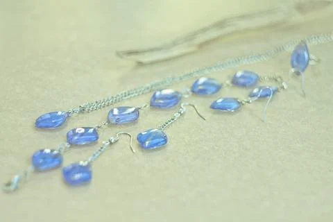 Close up craft bijouterie set with blue gems concept photo Stock Photos