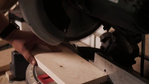 Close up. The craftman is working on electric saw machine. Sawing a board. Stock Footage 110342255