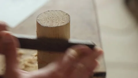 Close-up. a craftsman processes a piece of wood with a file. carpentry tools Stock Footage 156683142