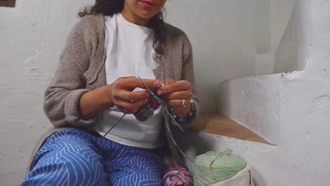 Close-up craftsman's hands casting on stitches on knitting needles, knitting woo Stock Footage 275680957