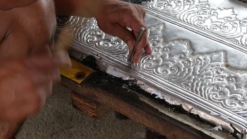 Close Up of Craftsman's Hands Working on Silver Panel Stock Footage 112246423