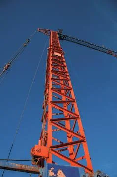 Close-up of crane in a construction area at sunset Stock Photos