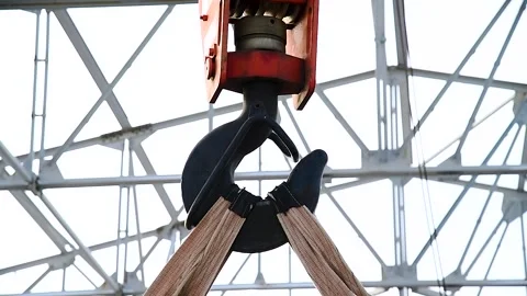 Close-up of a crane hook against a blue sky background Stock Footage 321242161