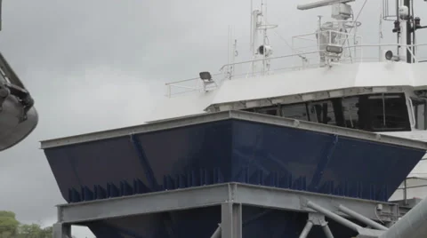 Close up of crane offloading grain Stock Footage 35633597