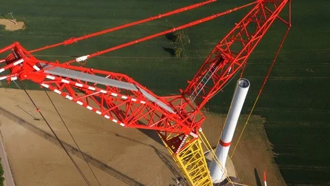 Close up of a crane in the process of being built with lifting the rotor. Video stock 73123976