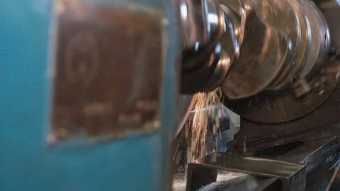 Close up of crankshaft on a grinding machine wheel operated by man hands Stock Footage 81547592
