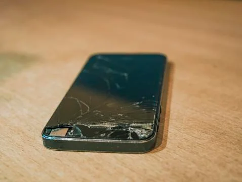 Close up crashed phone on the table Stock Photos