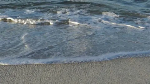 Close up of crashing waves on beach in Gulf Shores Stock Footage