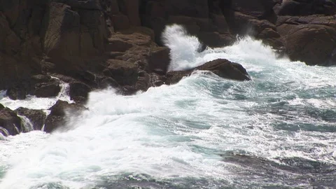 Close up of crashing waves on rocks in Cornwall, England Stock Footage 101490487