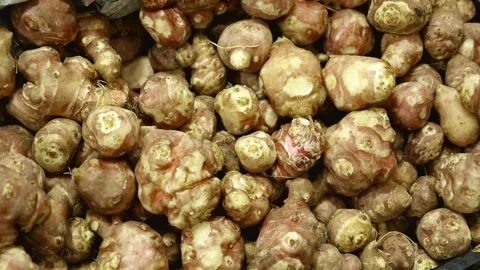 Close-up of a crate of fresh Jerusalem artichokes, Video stock 264069117