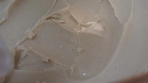 Close-Up of Creamy Beige Texture Being Stirred Stock-Footage 345293375