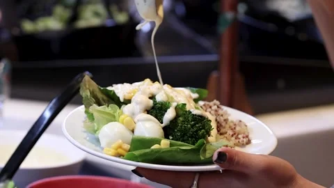 Close Up of Creamy Dressing Poured Over Fresh Garden Salad Stock Footage 328139117