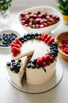 Close up. Creamy mascarpone cheese cake with strawberry and winter berries. N Stock Photos