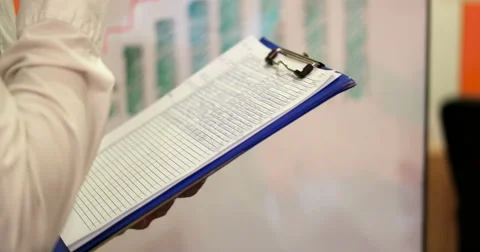 Close up of Creative Business manager presenting financial data to shareholde Stock Footage 67251197